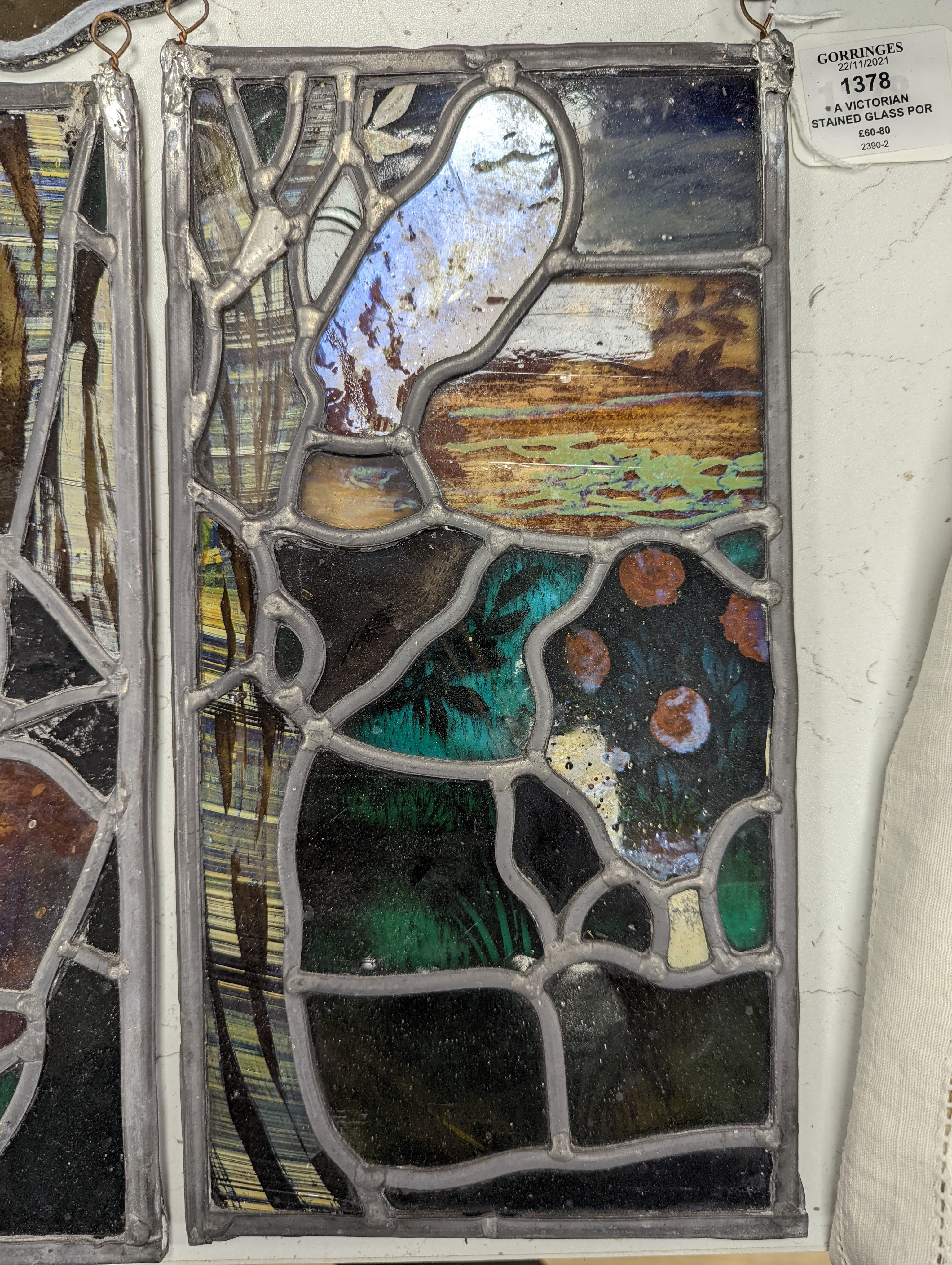 A Victorian stained glass portrait panel, two bird panels and a similar circular bird panel (4)